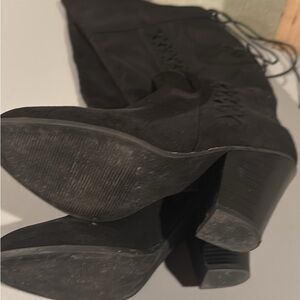 Black heeled thigh high boots